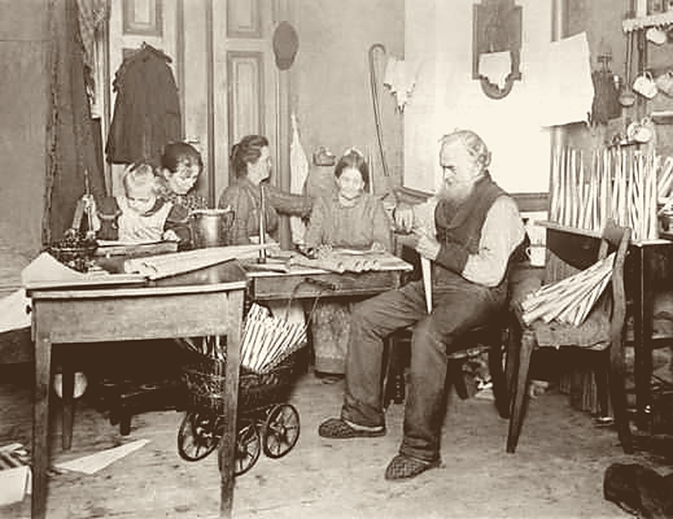 The same 1900 family photograph after restoration — clean, warm, and clear